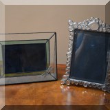 D28. 2 Glass picture frames.